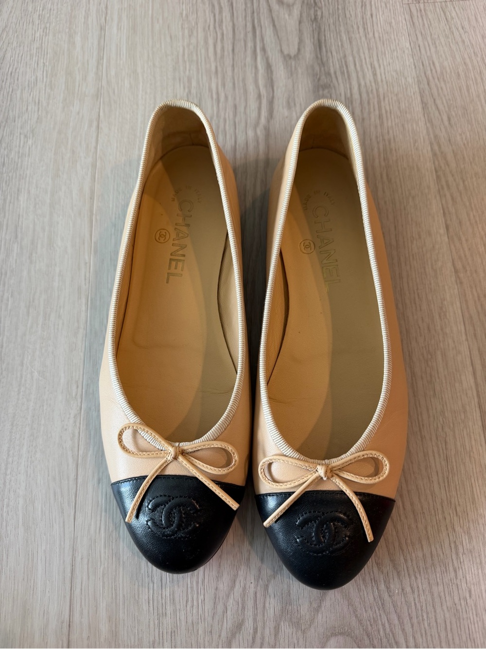 CHANEL Beige and Black Cap-Toe Ballet Flats with Bow